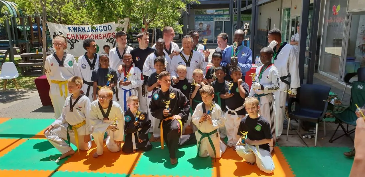 A large group of KJD children and instructors with their competition medals.