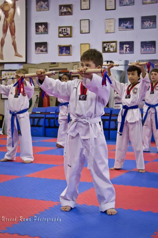 A student performing a nunchaku pattern.
